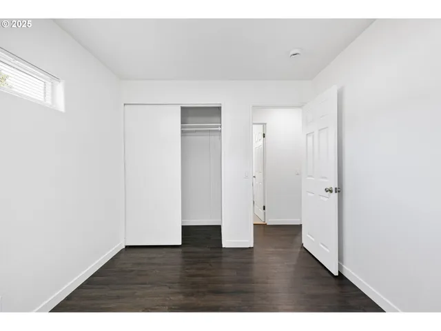 a view of a house with a yard and garage