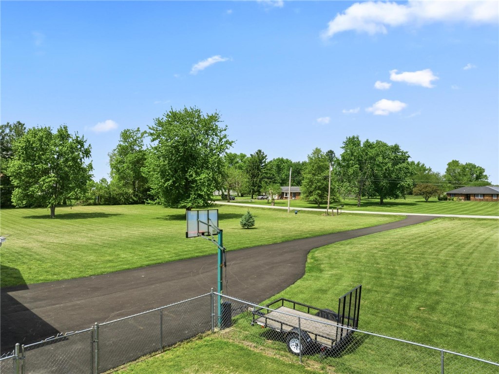 1353 Foust Road Xenia, OH 45385 - Photo 4 of 50 Expansive green yard with a private driveway leads to a charming residence.