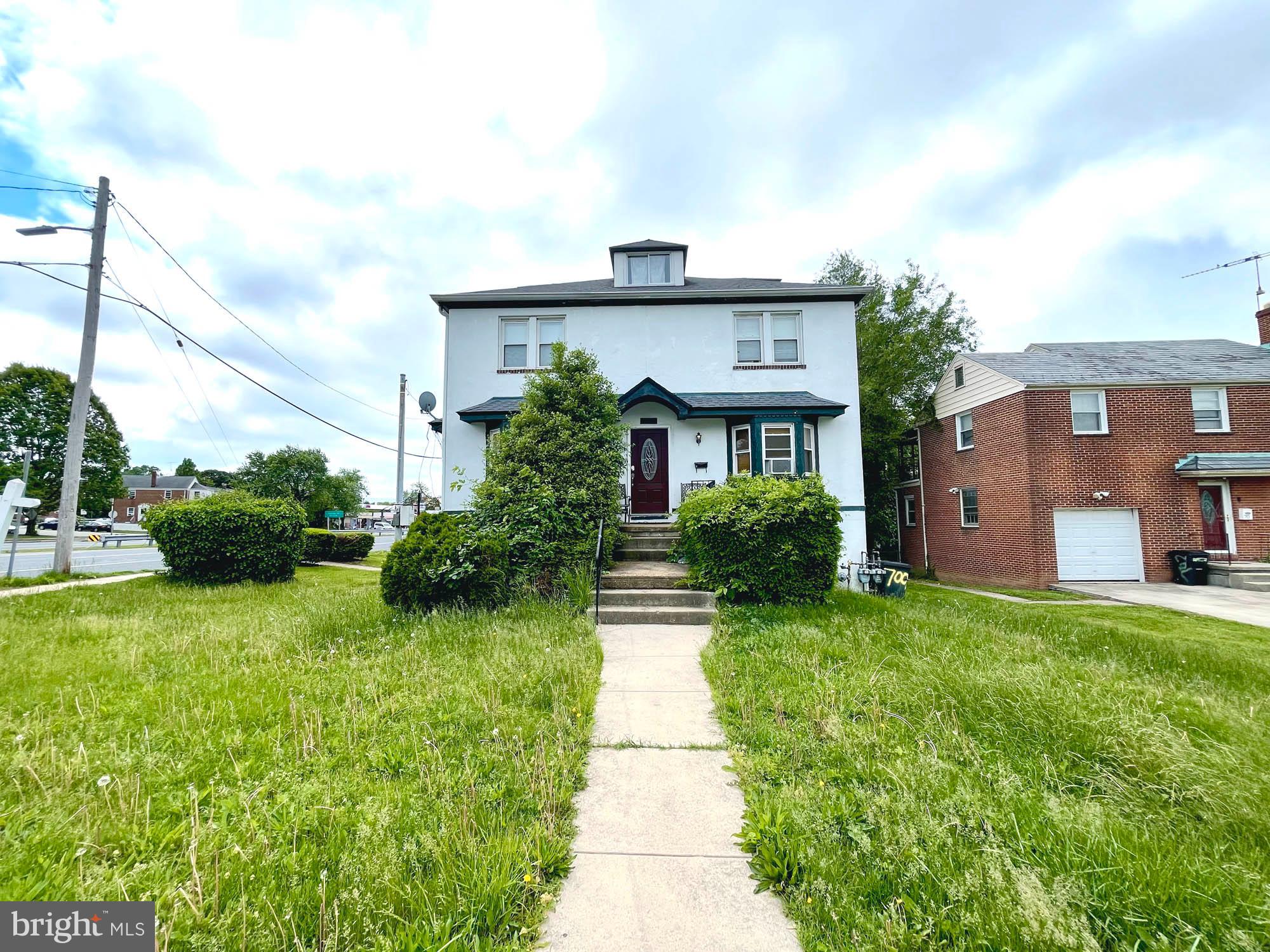 700 Charing Cross Road Baltimore, MD 21229 - Photo 6 of 7 a front view of a house with garden