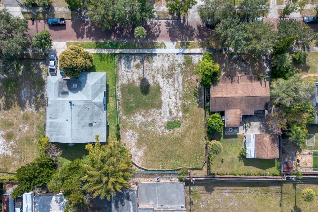 307 Harvard Street Orlando, FL 32804 - Photo 10 of 13 an aerial view of a house with outdoor swimming pool and tennis court