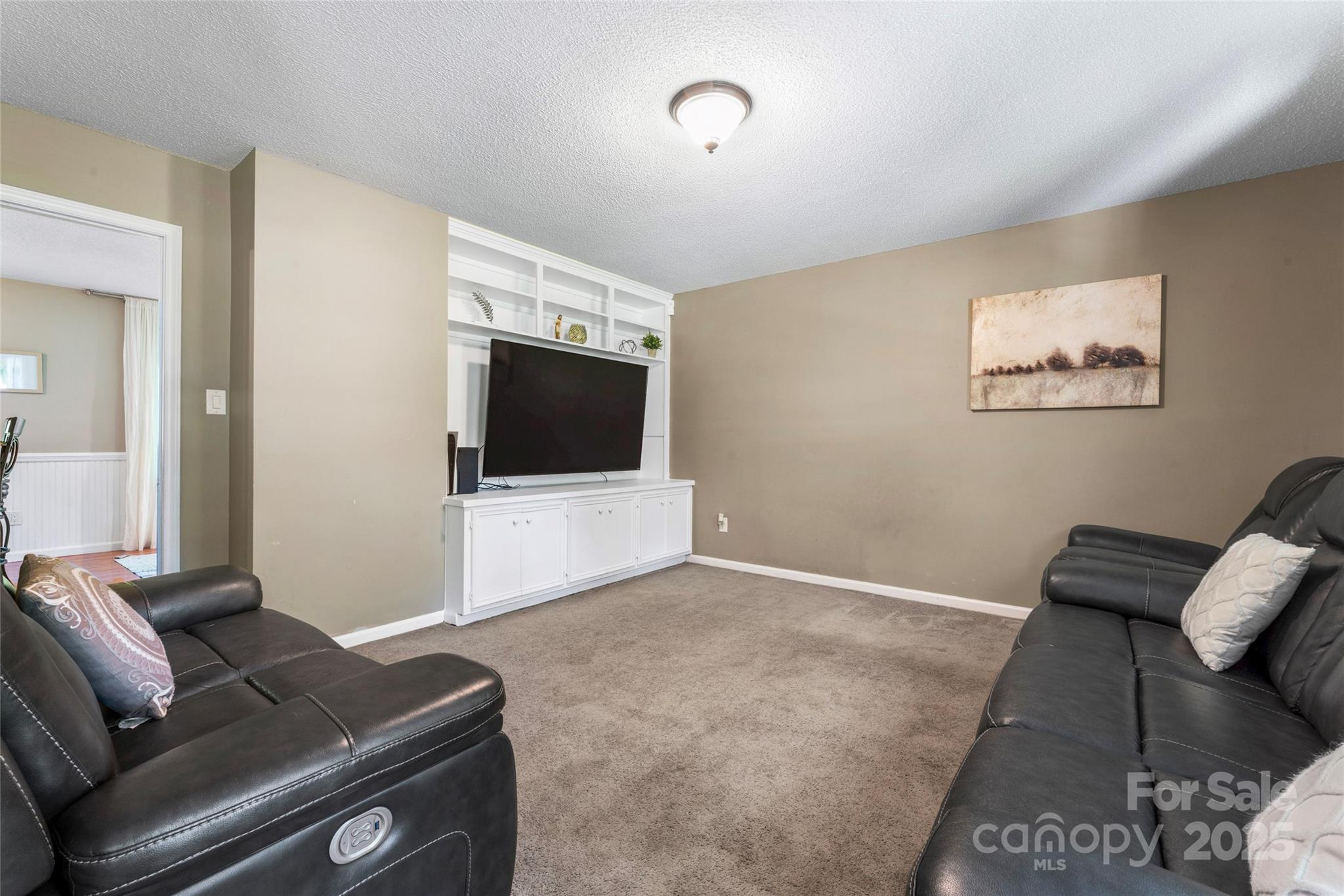 335 Bob White Run Salisbury, NC 28147 - Photo 19 of 41 a living room with furniture and a flat screen tv