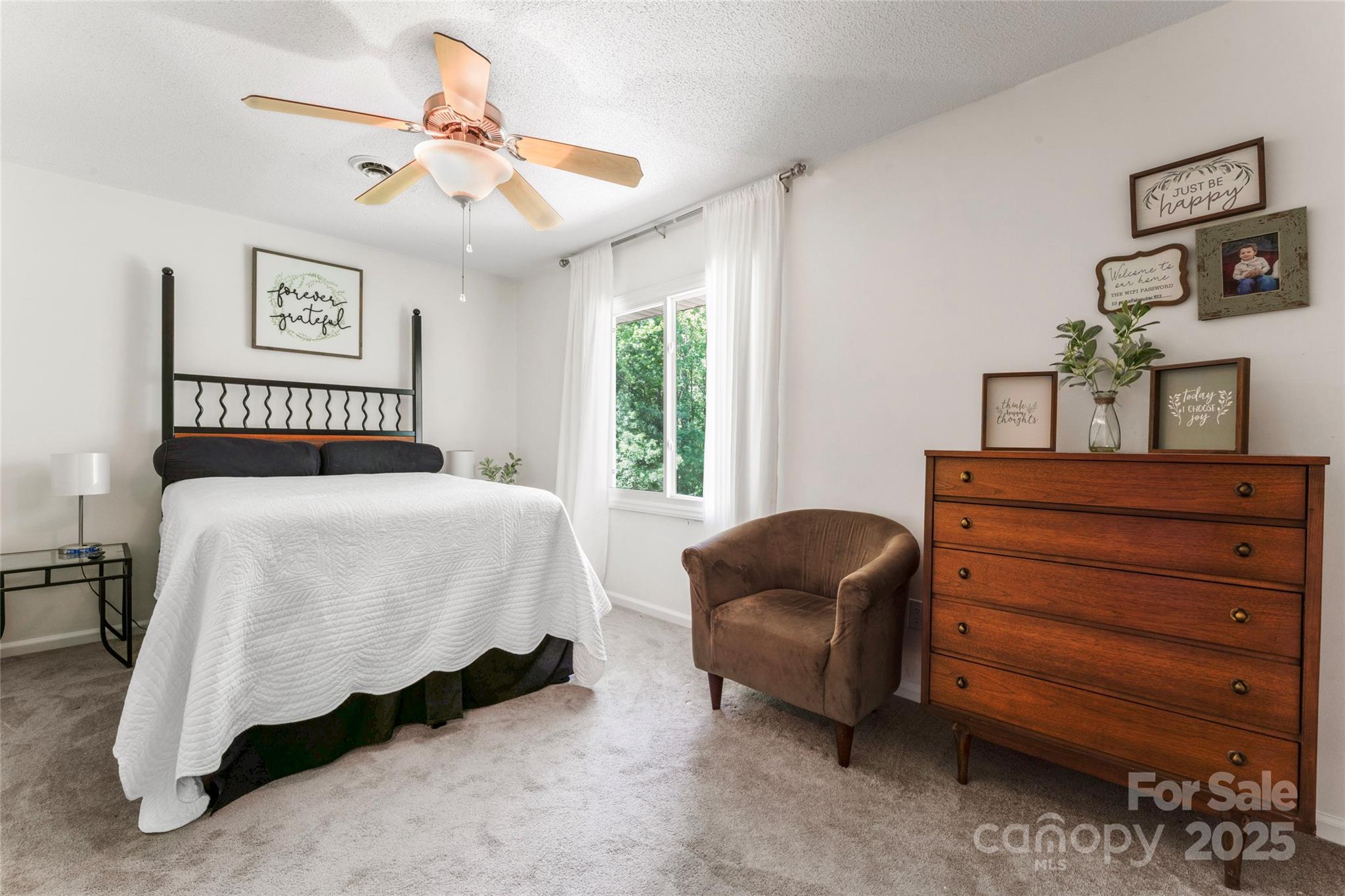 335 Bob White Run Salisbury, NC 28147 - Photo 24 of 41 a bedroom with a bed and a couch