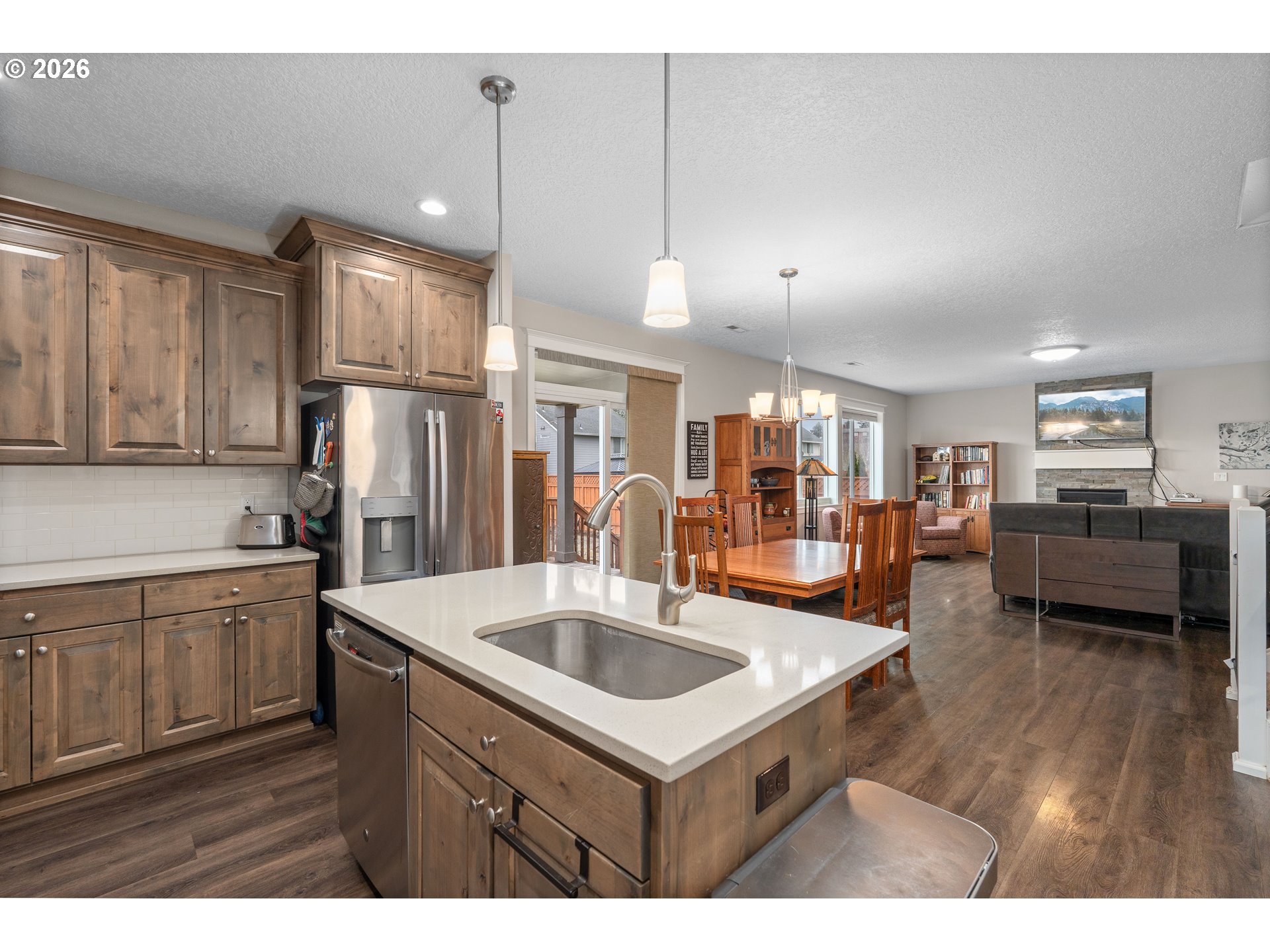 2958 Southwest Redmond Hill Road McMinnville, OR 97128 - Photo 11 of 40 a kitchen with stainless steel appliances granite countertop a sink refrigerator and cabinets