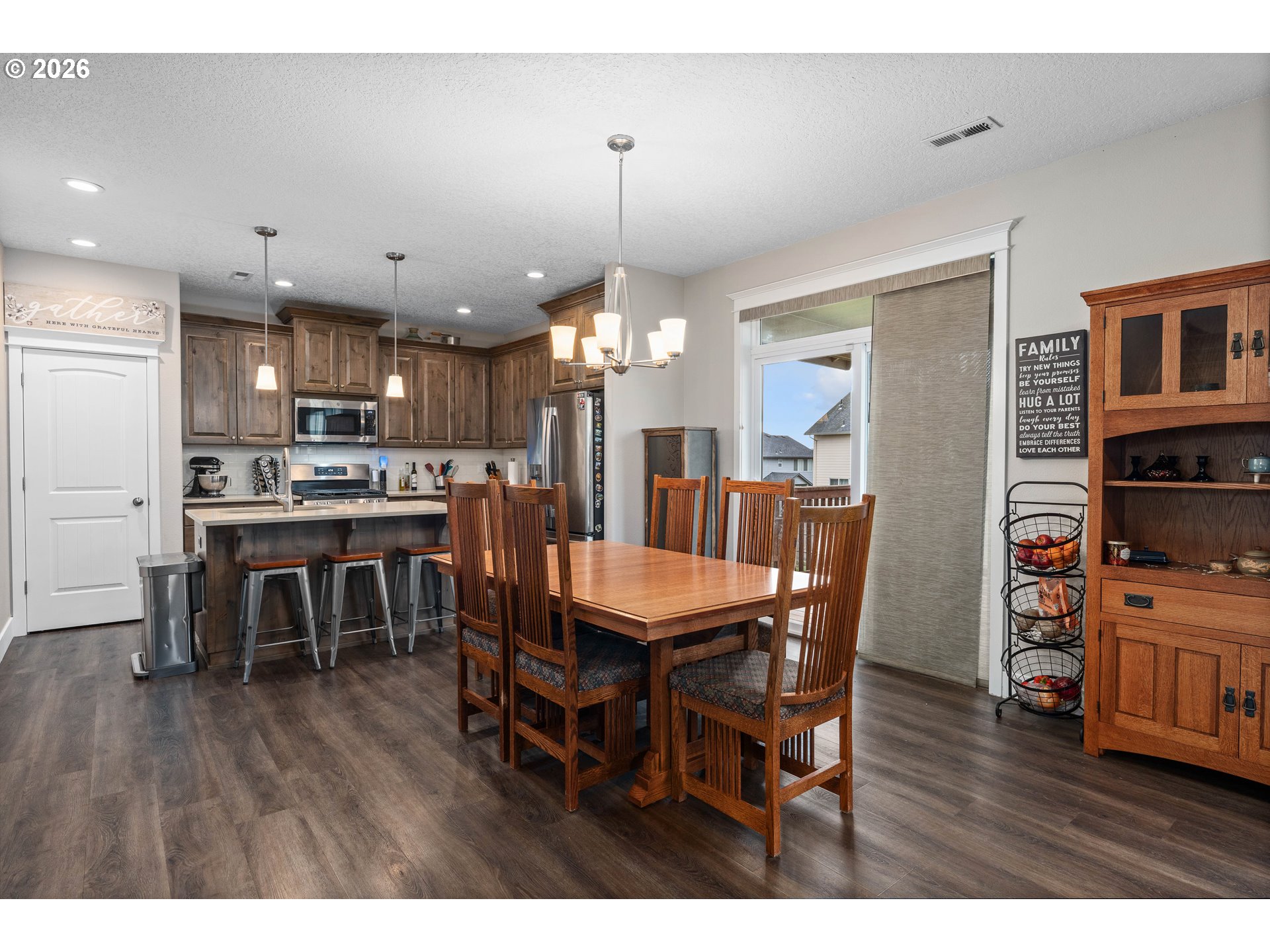 2958 Southwest Redmond Hill Road McMinnville, OR 97128 - Photo 12 of 40 a dining room with furniture and wooden floor