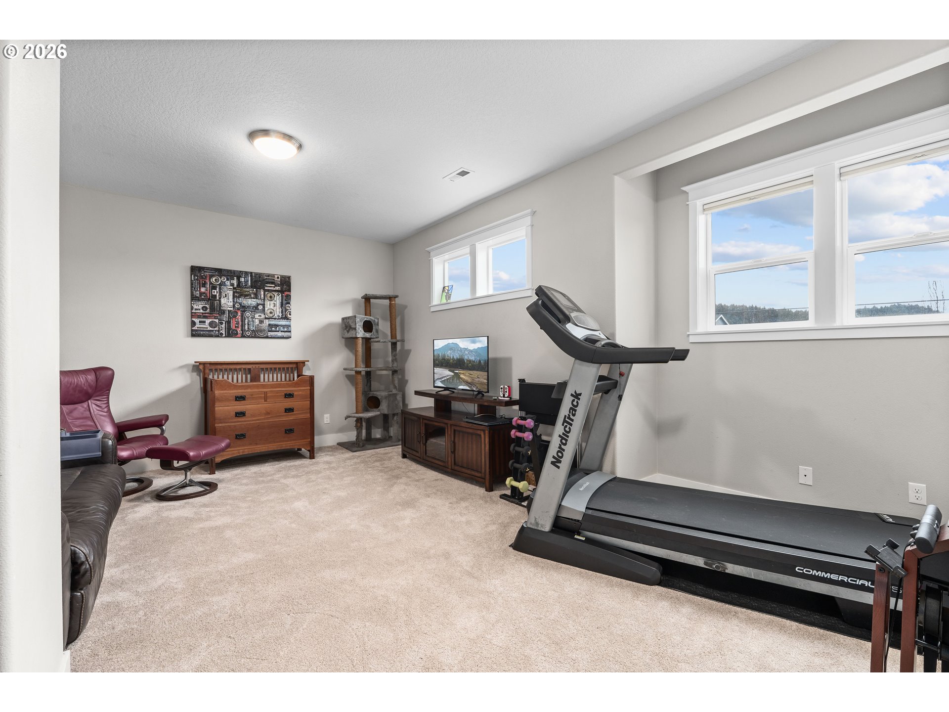 2958 Southwest Redmond Hill Road McMinnville, OR 97128 - Photo 16 of 40 a room with gym equipment and a large window