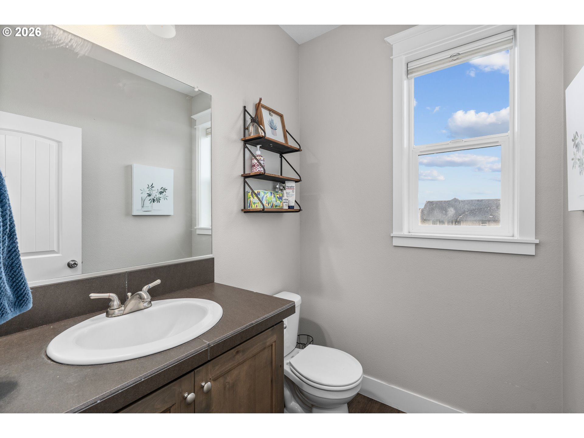 2958 Southwest Redmond Hill Road McMinnville, OR 97128 - Photo 17 of 40 a bathroom with a granite countertop sink and a mirror