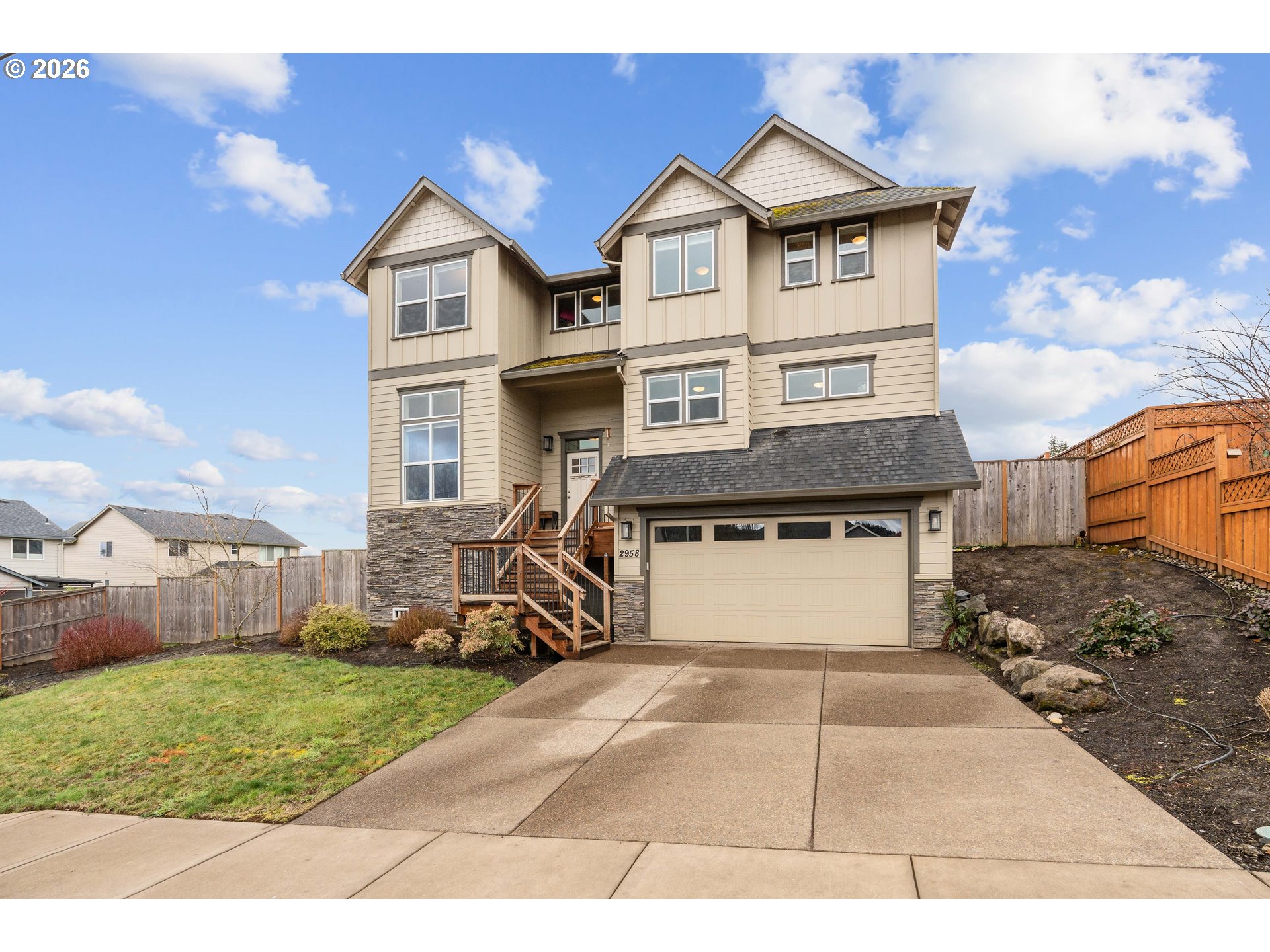 2958 Southwest Redmond Hill Road McMinnville, OR 97128 - Photo 2 of 40 a front view of a house with a yard and garage