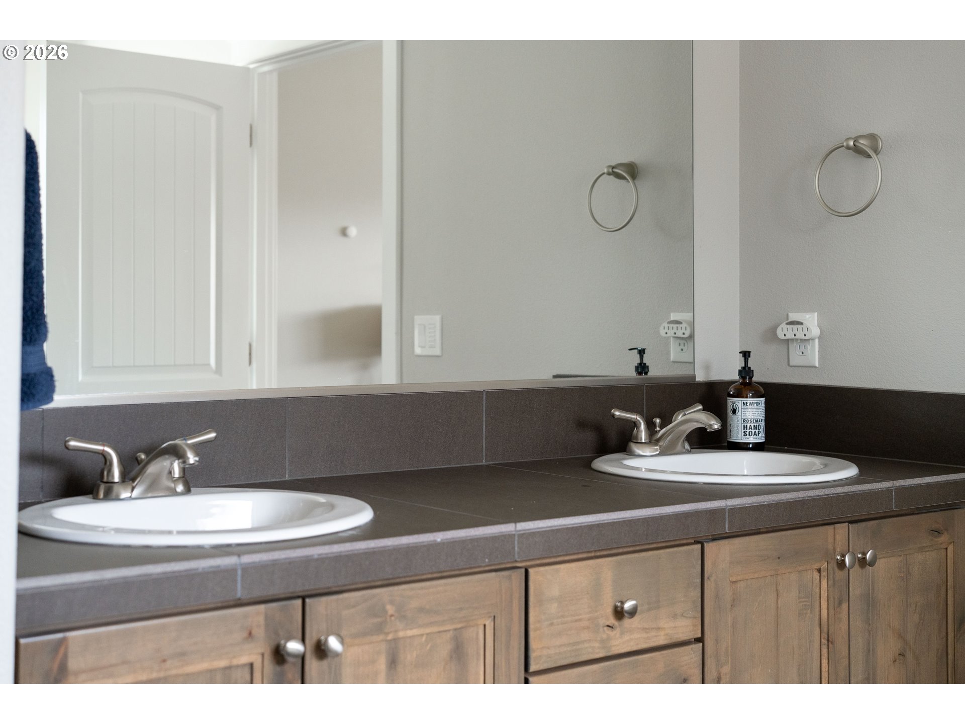 2958 Southwest Redmond Hill Road McMinnville, OR 97128 - Photo 23 of 40 a bathroom with a sink and a mirror