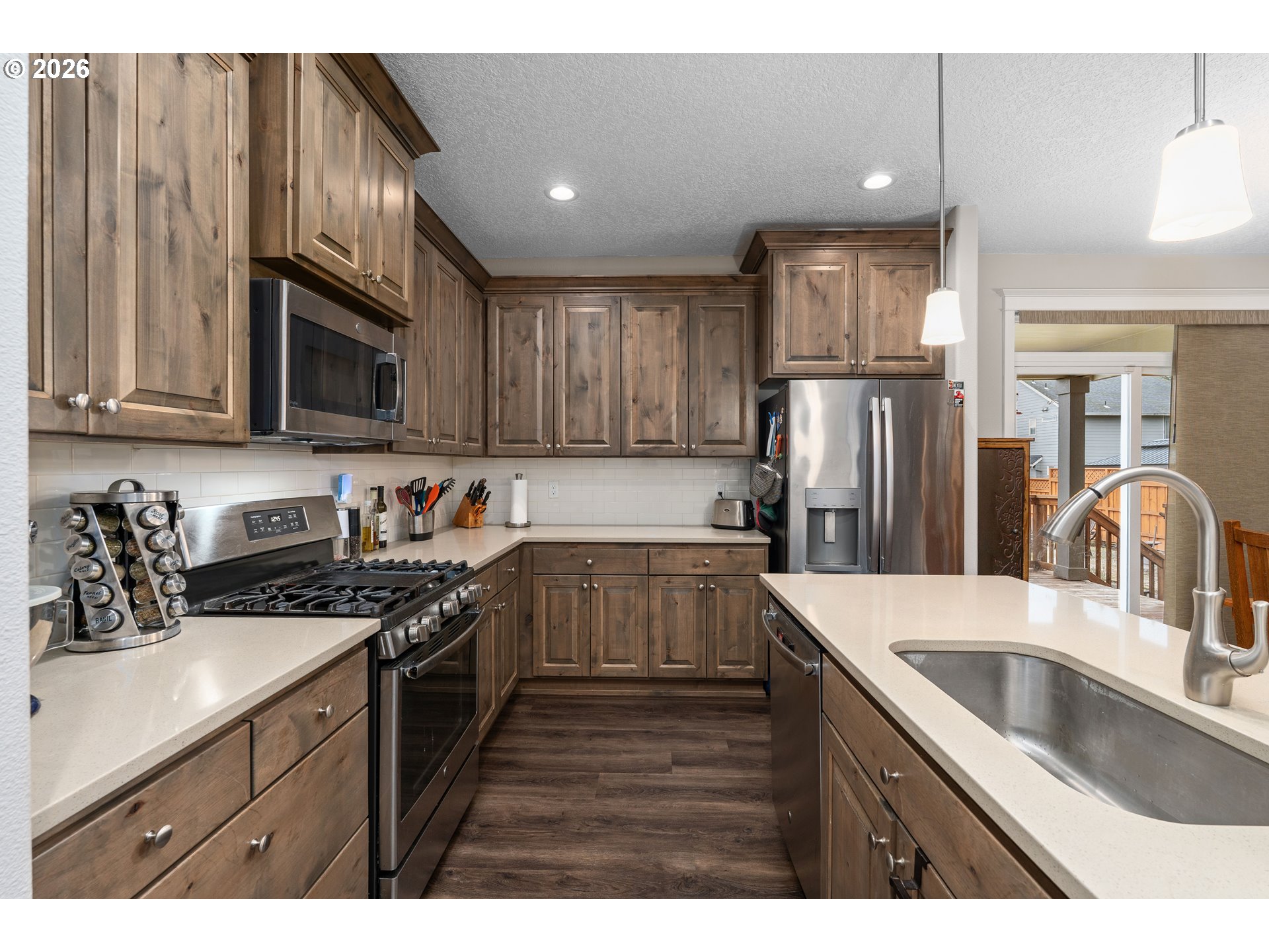 2958 Southwest Redmond Hill Road McMinnville, OR 97128 - Photo 8 of 40 a kitchen with a sink stove and refrigerator