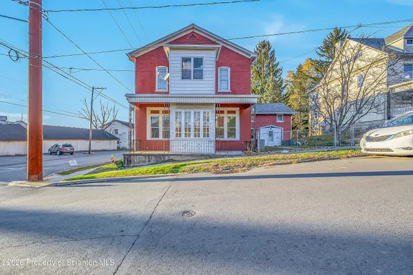 a view of pool with brick walls