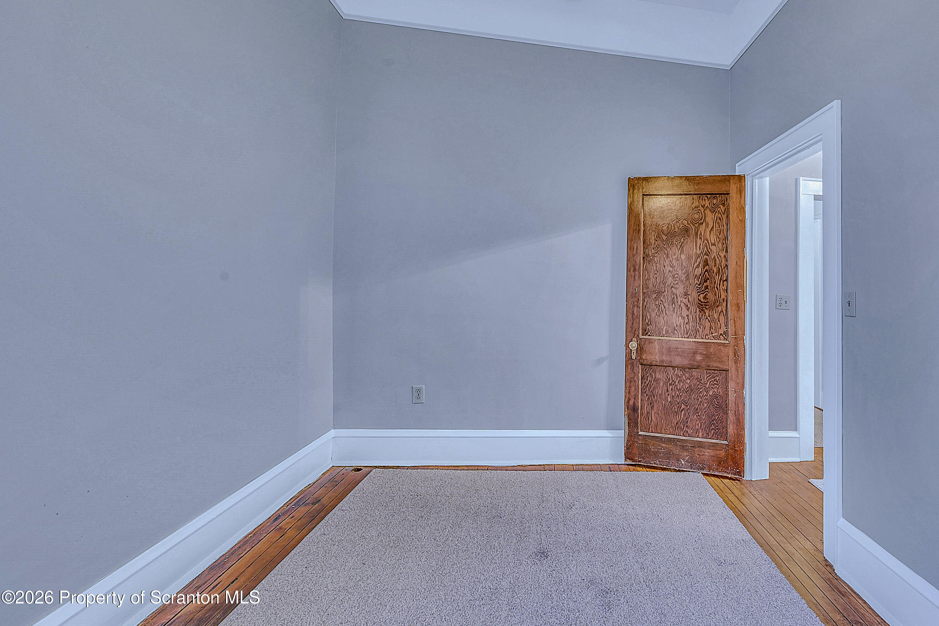 714 Smith Street Dunmore, PA 18512 - Photo 14 of 15 wooden floor in an empty room