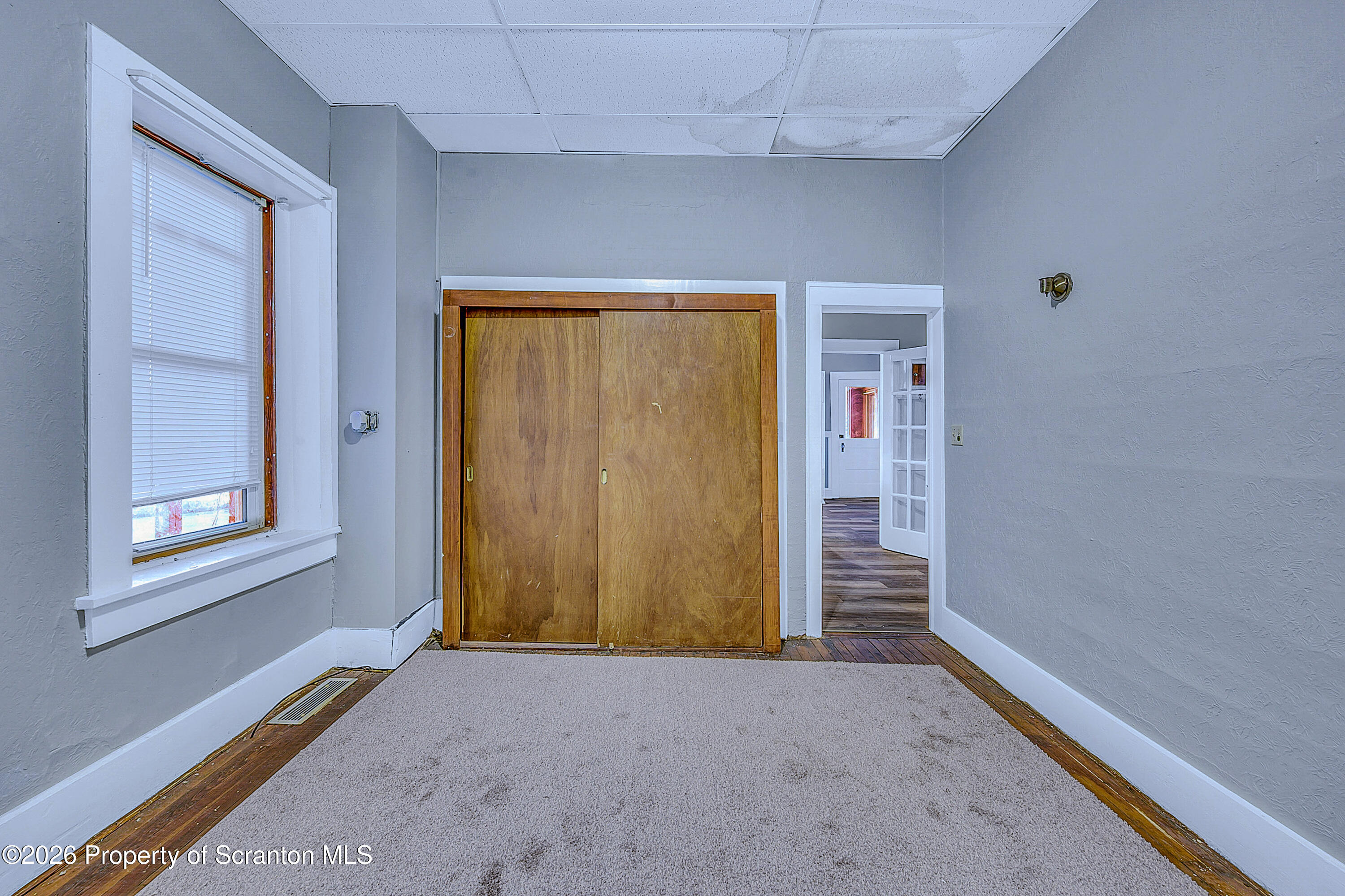 714 Smith Street Dunmore, PA 18512 - Photo 2 of 15 a view of an empty room with a window