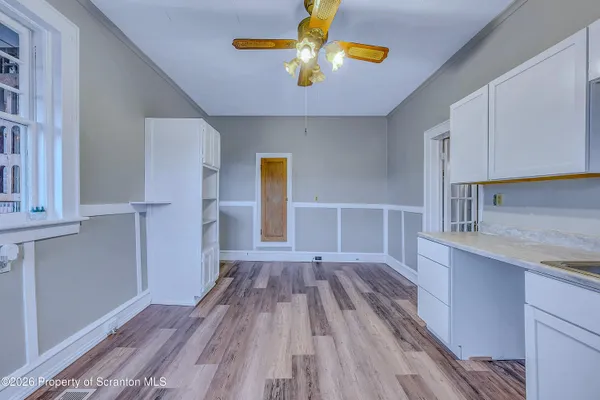 a view of kitchen and wooden floor