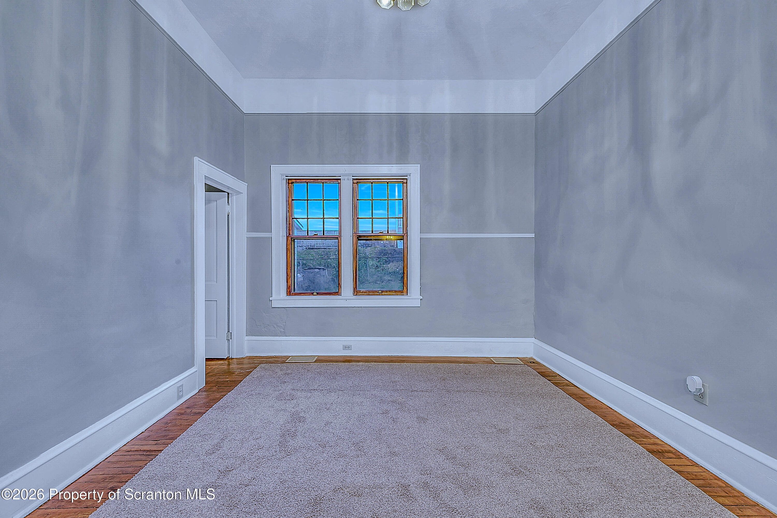 714 Smith Street Dunmore, PA 18512 - Photo 8 of 15 a view of an empty room with a window