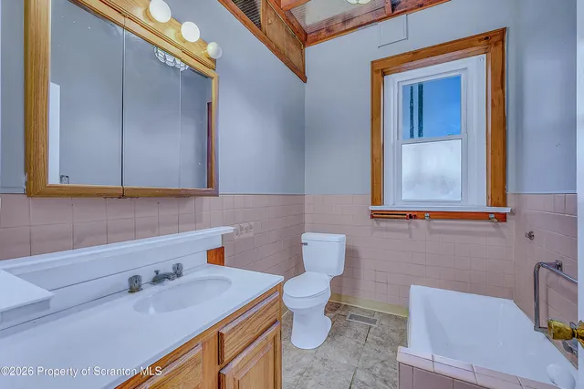 a bathroom with a sink and a toilet