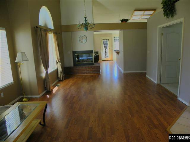 5860 Simons Drive Reno, NV 89523 - Photo 2 of 9 a view of a livingroom with furniture and a fireplace