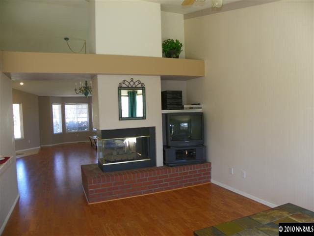 5860 Simons Drive Reno, NV 89523 - Photo 3 of 9 a living room with furniture and a fireplace