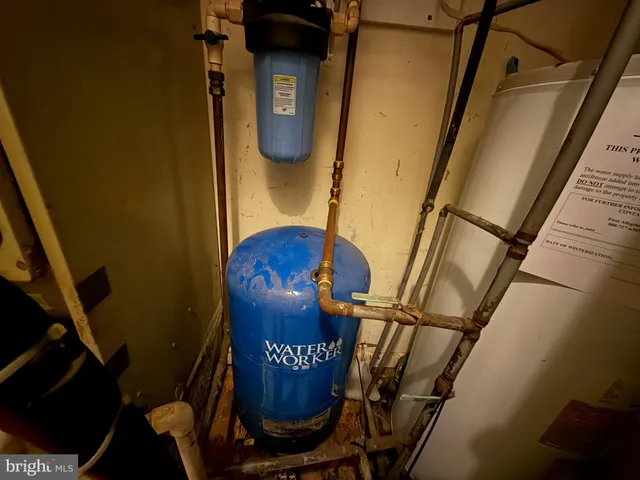 a kitchen with granite countertop a sink stove and cabinets