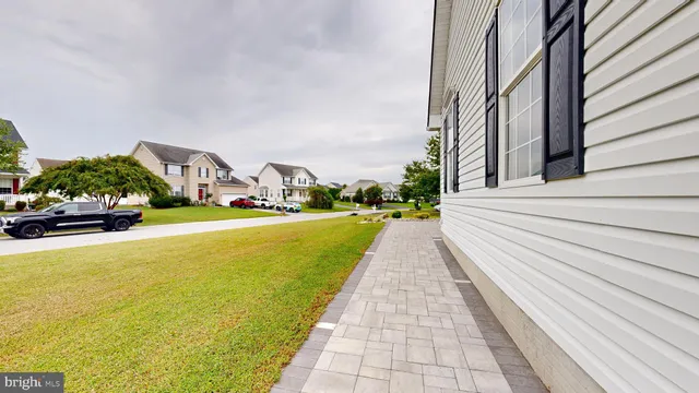 a bathroom with a sink vanity granite and toilet