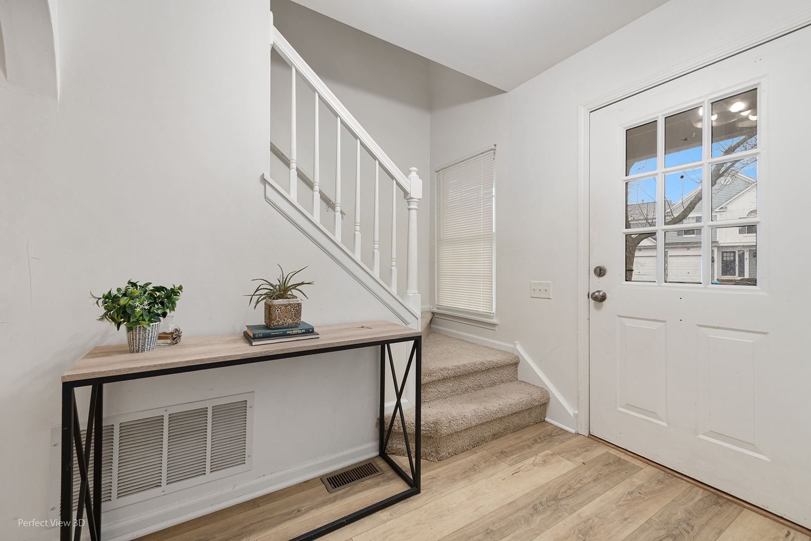 170 Half Moon Circle Aurora, IL 60504 - Photo 12 of 23 a view of entryway with wooden floor and stairs
