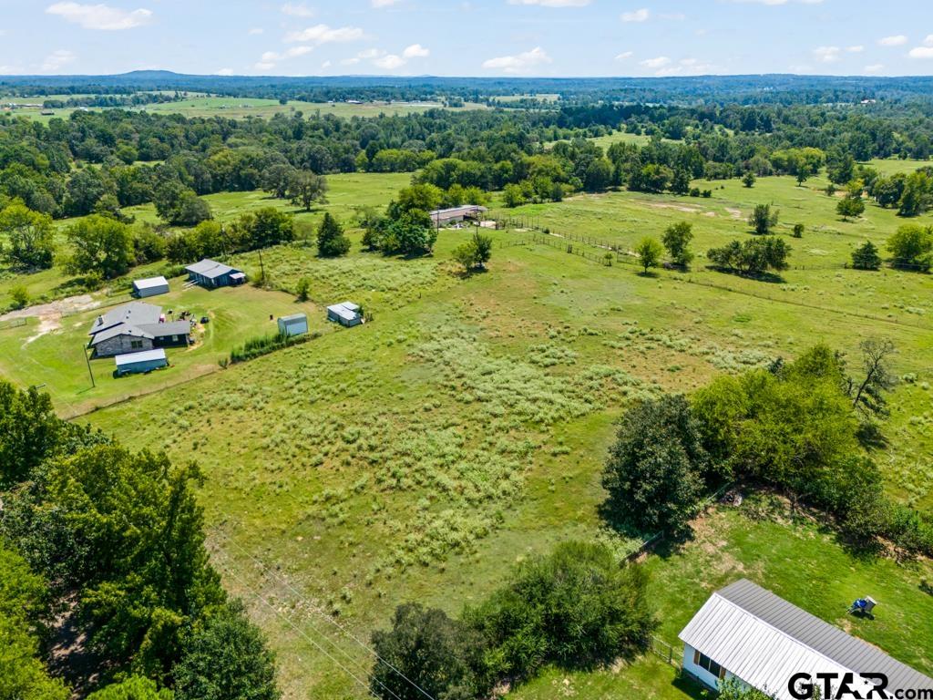 7981 Arrowwood Road Gilmer, TX 75644 - Photo 37 of 39 a view of a garden with an outdoor seating and mountain view