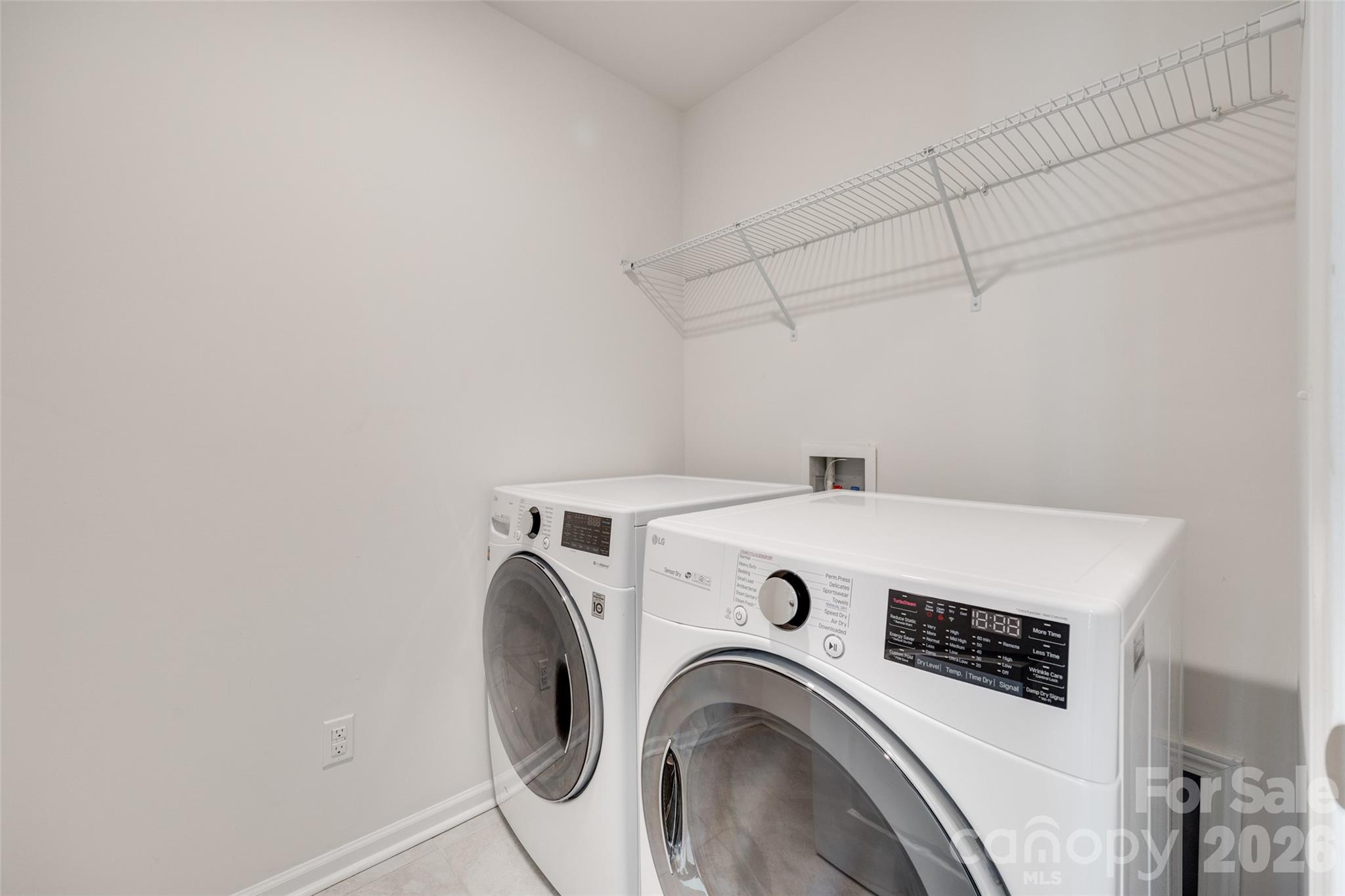 642 Altamonte Drive Clover, SC 29710 - Photo 27 of 41 a view of washer and dryer with kitchen in the background