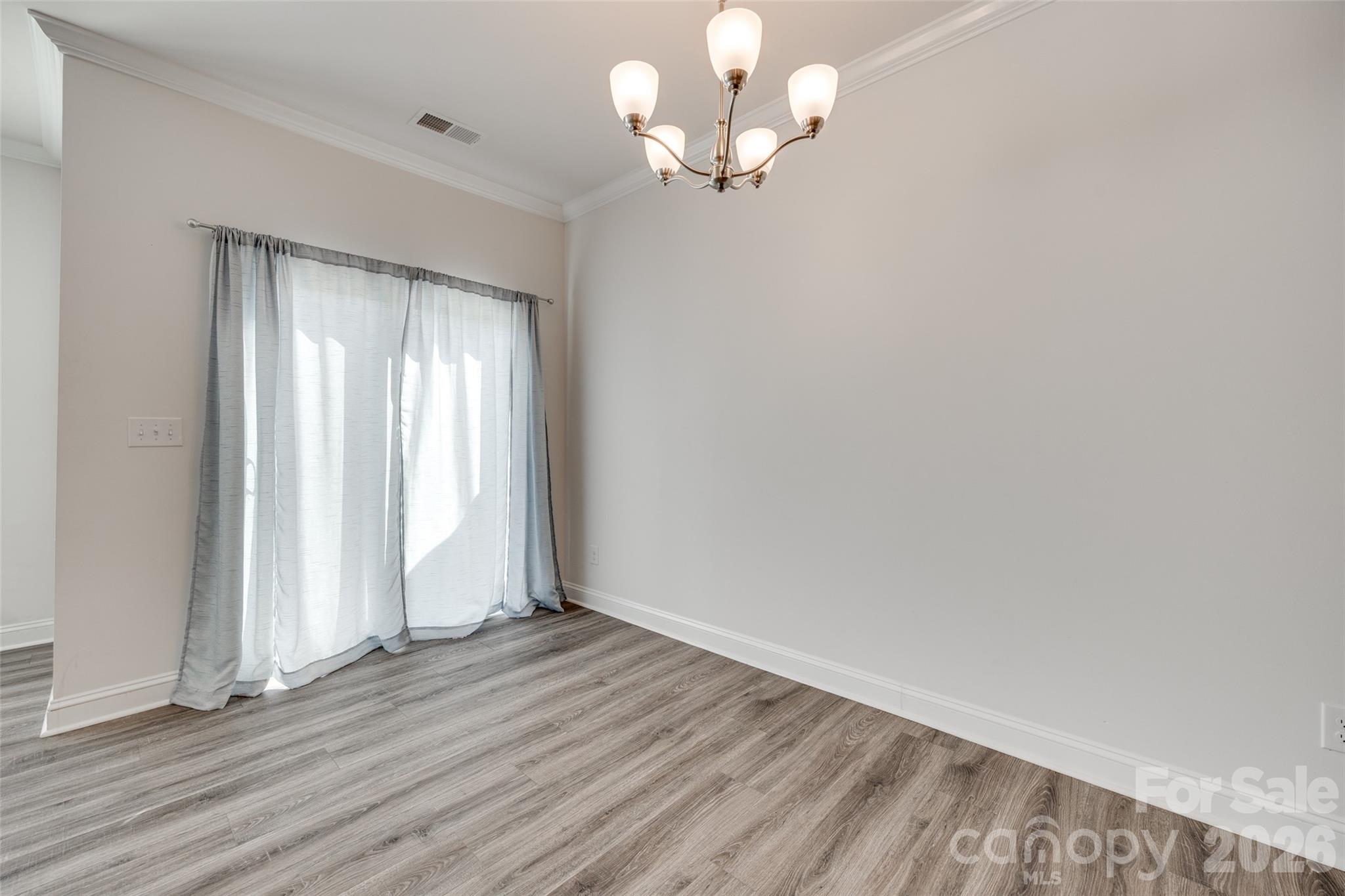 642 Altamonte Drive Clover, SC 29710 - Photo 30 of 41 wooden floor in an empty room with a window