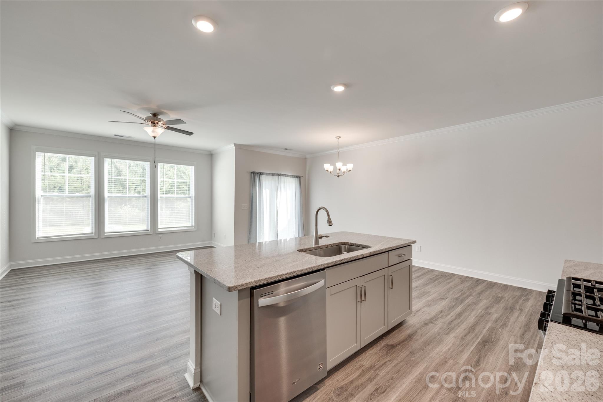 642 Altamonte Drive Clover, SC 29710 - Photo 32 of 41 a kitchen with sink cabinets and wooden floor