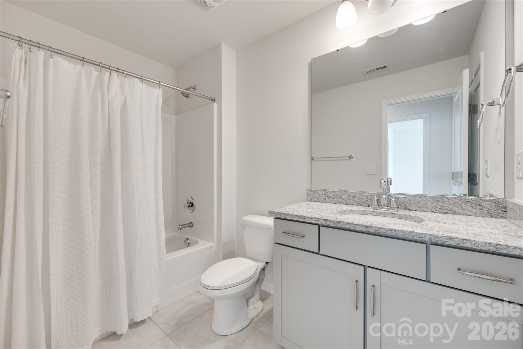642 Altamonte Drive Clover, SC 29710 - Photo 34 of 41 a bathroom with a granite countertop sink toilet and shower