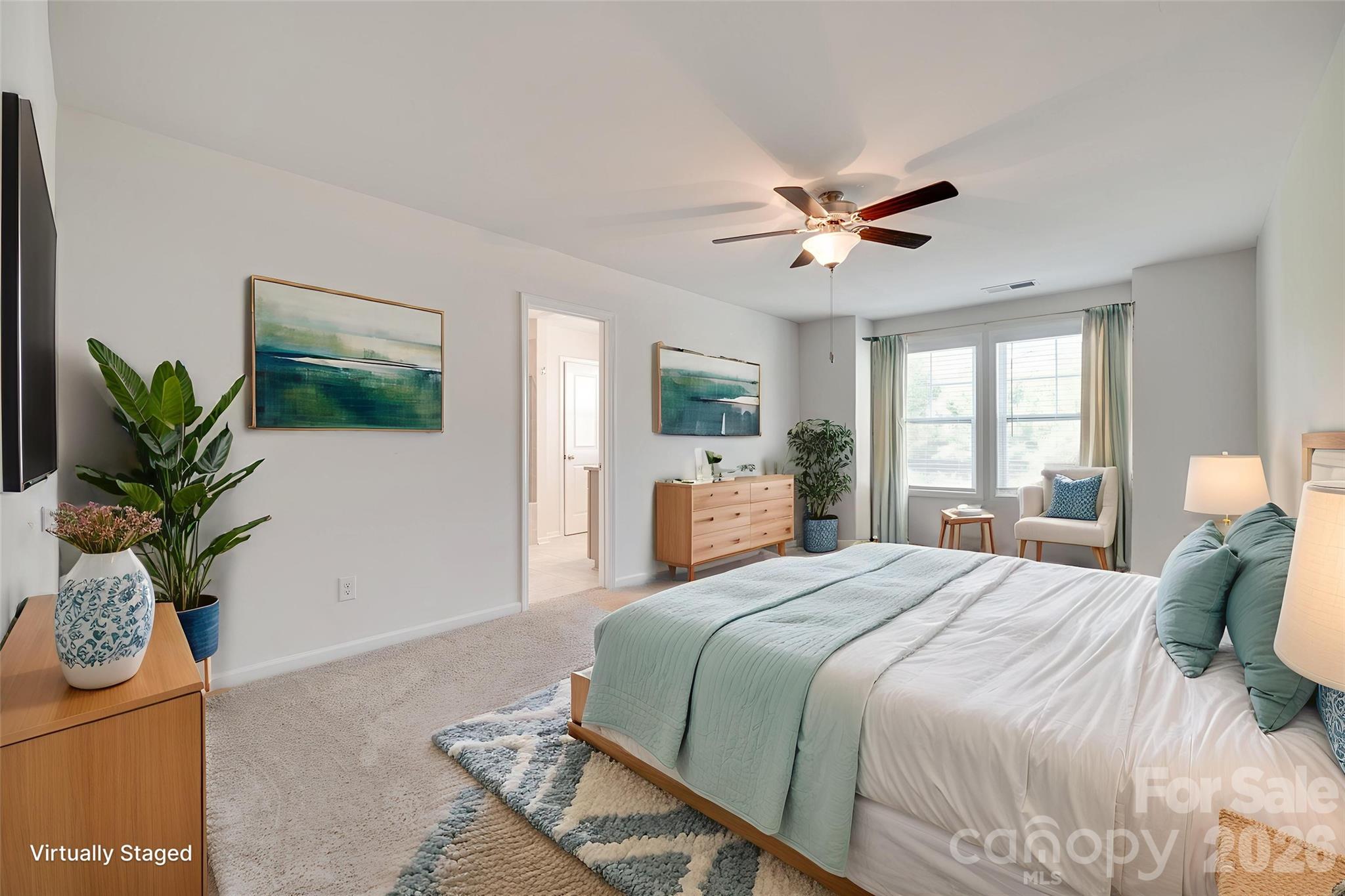 642 Altamonte Drive Clover, SC 29710 - Photo 4 of 41 a bedroom with a large bed potted plant and a window