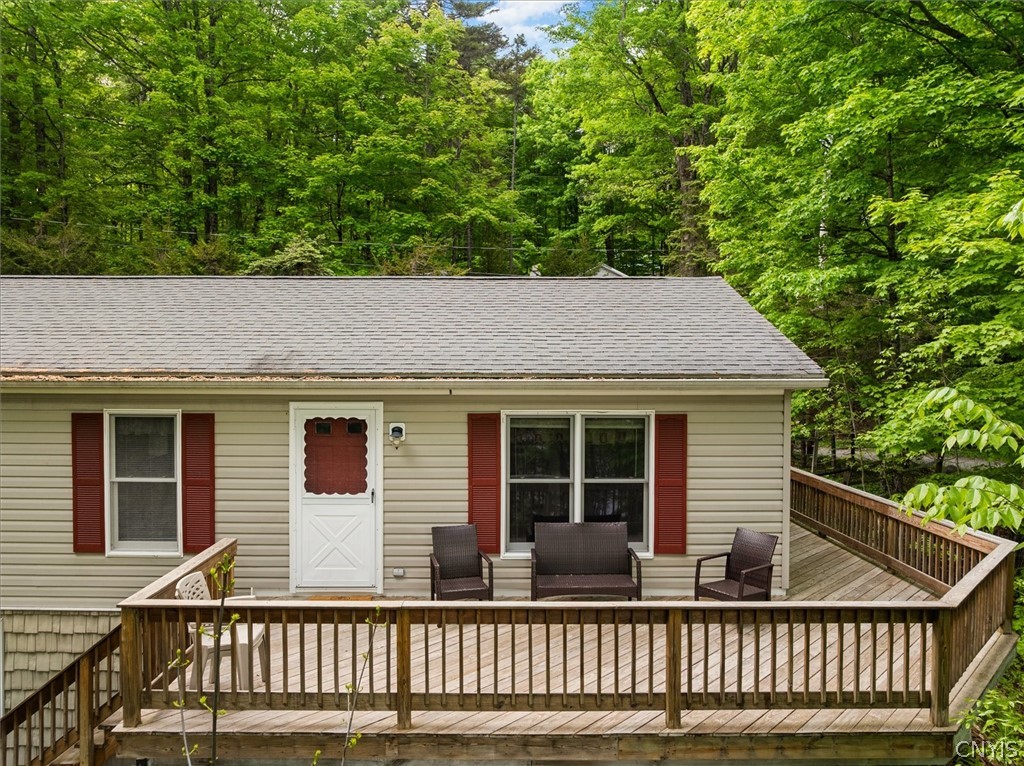 182 Oneida Road Webb, NY 13420 - Photo 2 of 29 Great wrap around deck with views of First Lake!