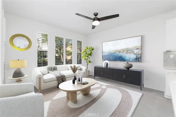 an empty room with a ceiling fan and a window