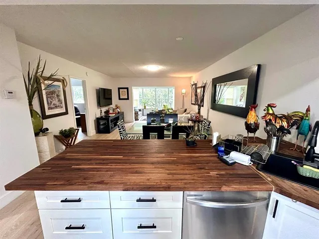 a room with wooden floor and furniture