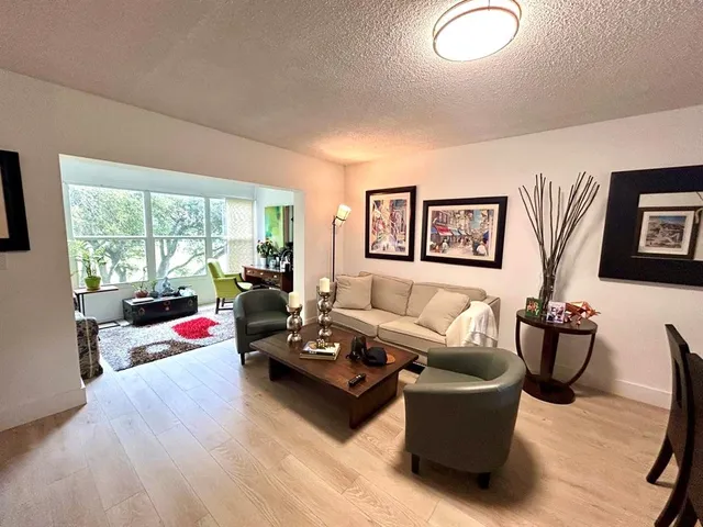 a living room with furniture window and couch