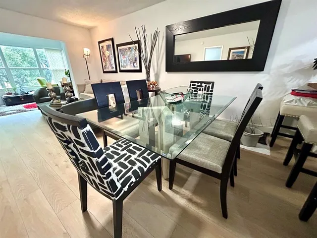 a view of a livingroom with furniture and a flat screen tv