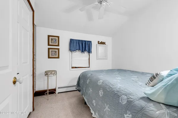 a bedroom with a bed and a cabinets