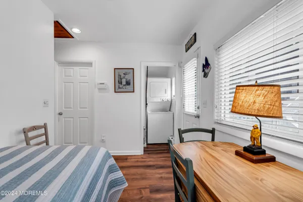 a bedroom with bed and a window