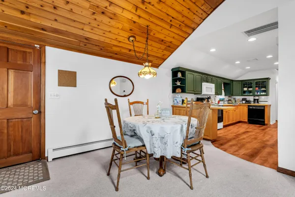a view of a dining room with furniture