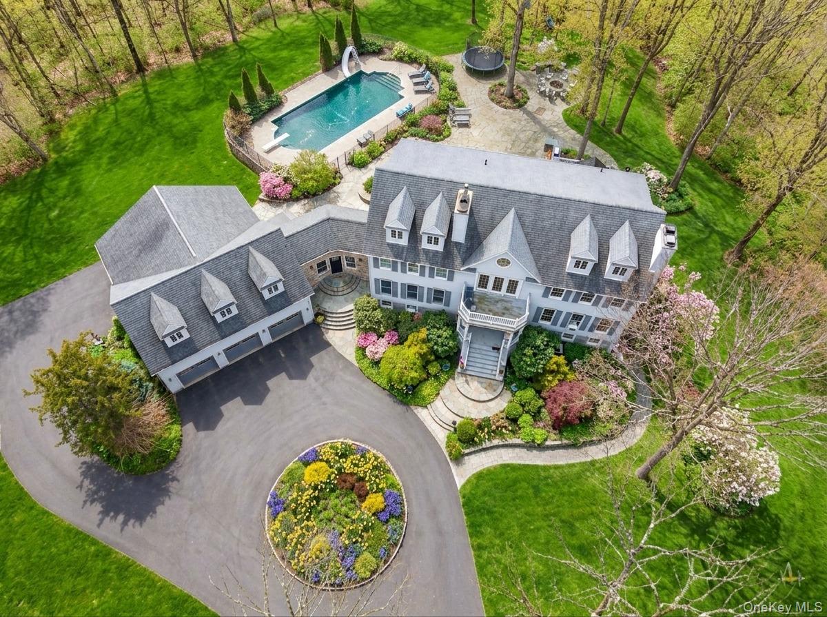 16 Sunset Ridge Monroe, NY 10950 - Photo 2 of 14 an aerial view of a house with a garden and trees