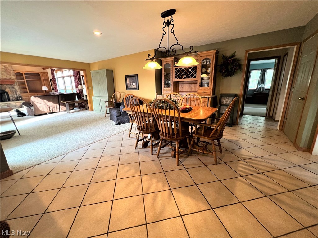 Dining space with light tile floors