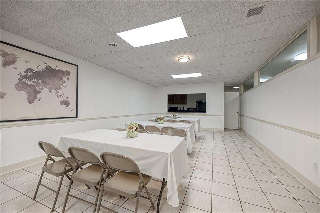5 Bayard Road, Unit 309 Pittsburgh, PA 15213 - Photo 17 of 19 a view of a dining room with furniture and a kitchen