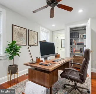 a view of a workspace with furniture