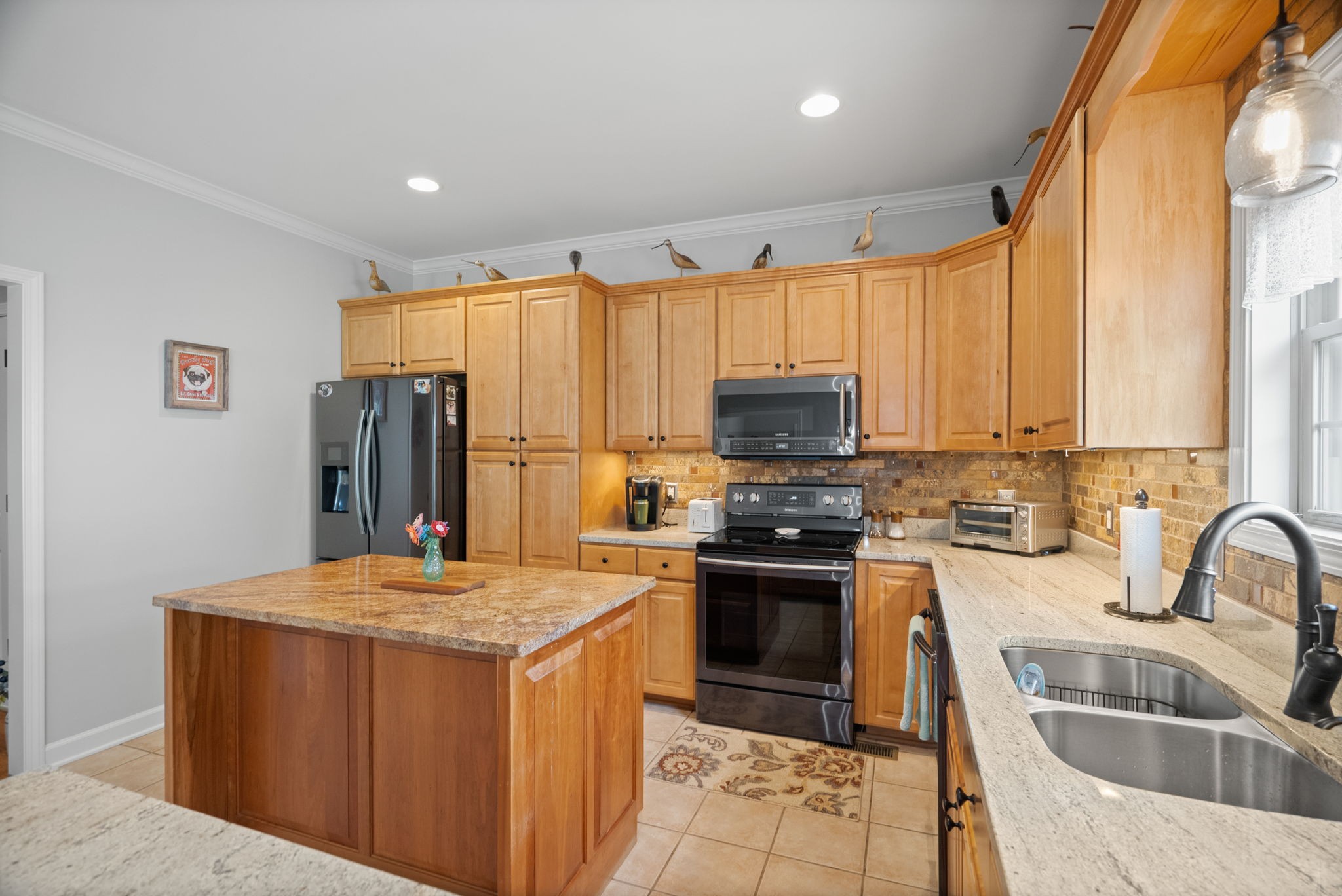 3008 Burts Crossing Springfield, TN 37172 - Photo 18 of 45 a kitchen with stainless steel appliances a stove sink refrigerator and microwave