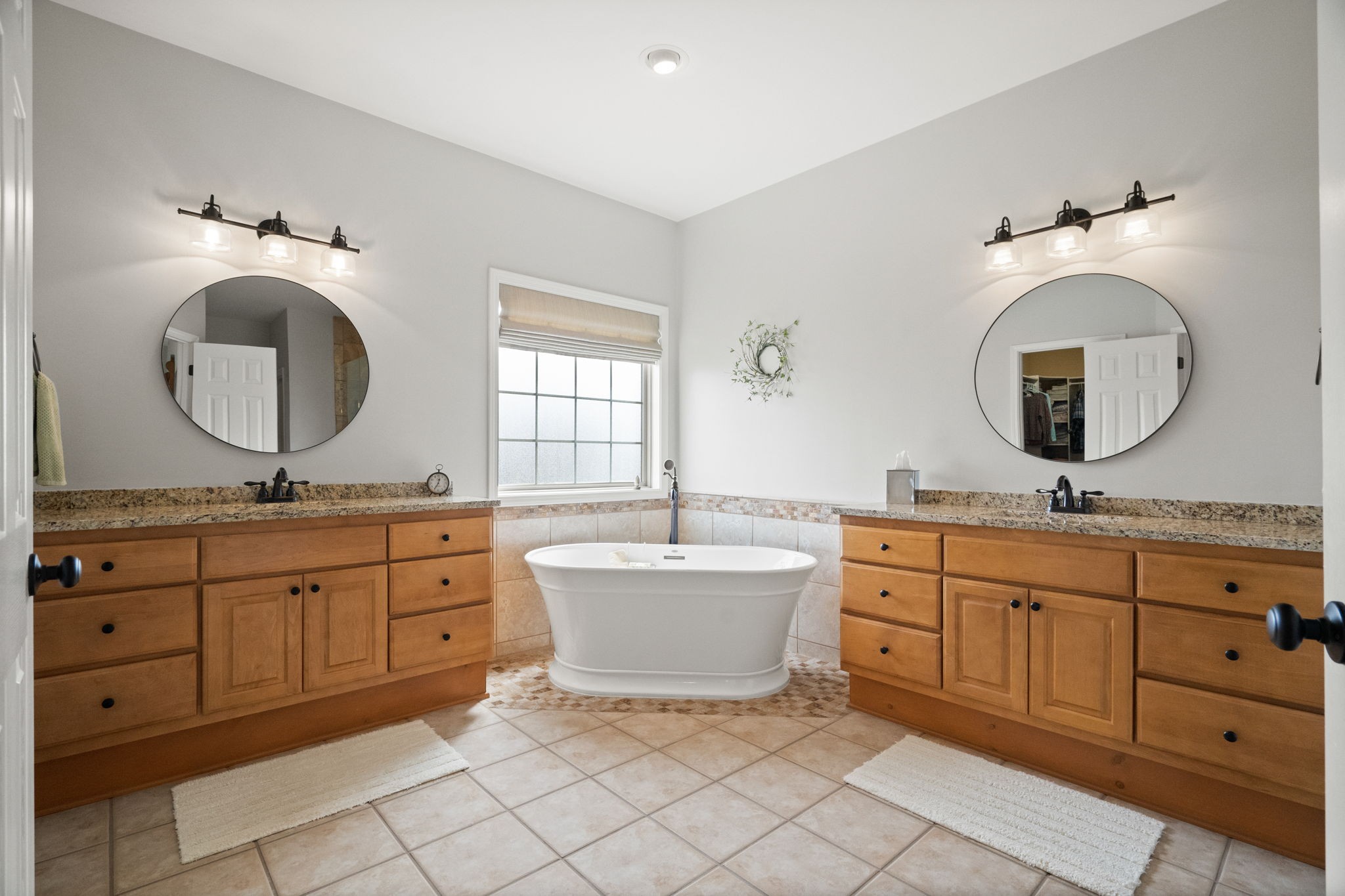 3008 Burts Crossing Springfield, TN 37172 - Photo 28 of 45 a bathroom with a granite countertop sink mirror and bathtub