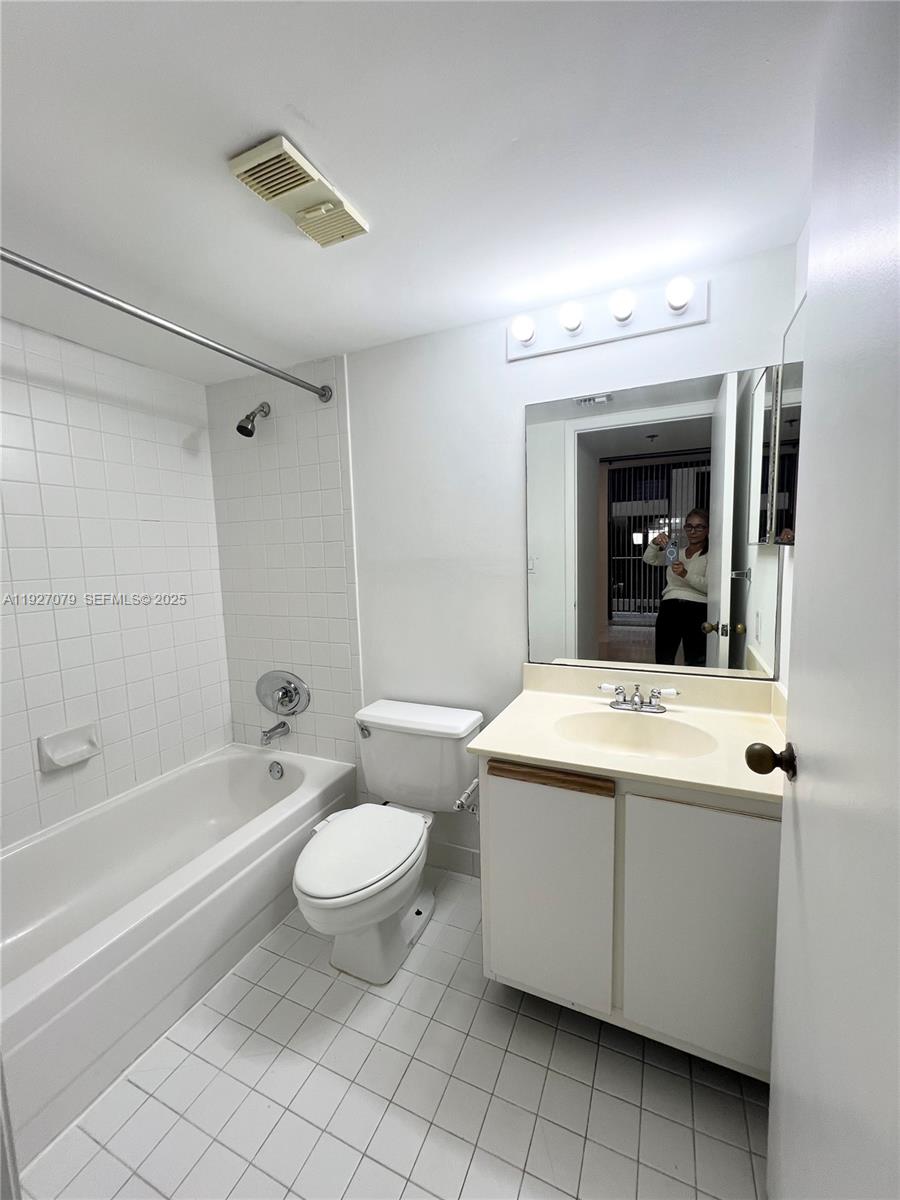 540 Brickell Key Drive, Unit 214 Miami, FL 33131 - Photo 15 of 48 a bathroom with a sink a toilet and shower
