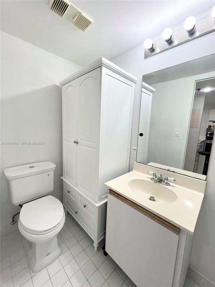 540 Brickell Key Drive, Unit 214 Miami, FL 33131 - Photo 21 of 48 a bathroom with a sink a toilet and shower