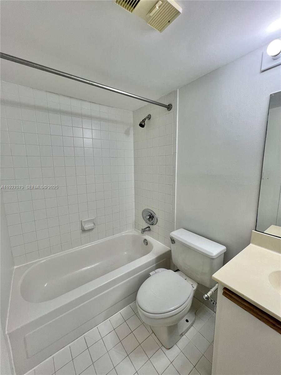 540 Brickell Key Drive, Unit 214 Miami, FL 33131 - Photo 23 of 48 a bathroom with a toilet and a bath tub