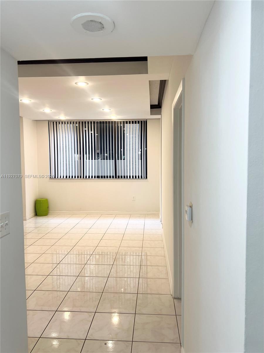 540 Brickell Key Drive, Unit 214 Miami, FL 33131 - Photo 24 of 48 a view of a room with a baby crib and wooden floor