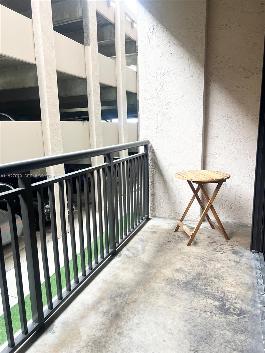 540 Brickell Key Drive, Unit 214 Miami, FL 33131 - Photo 3 of 48 a view of a balcony with furniture