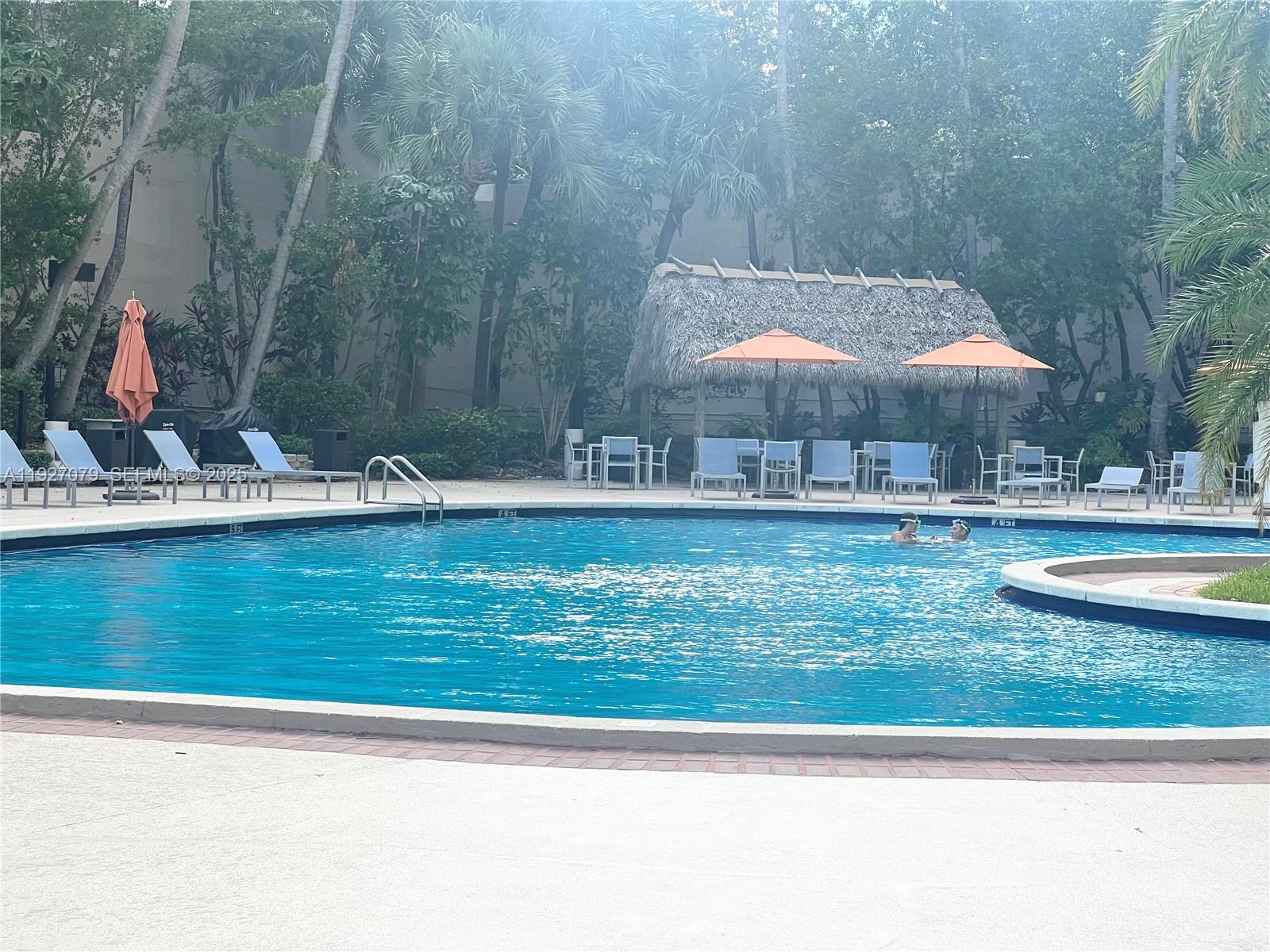 540 Brickell Key Drive, Unit 214 Miami, FL 33131 - Photo 42 of 48 a backyard of a house with barbeque oven